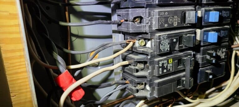 image of a triple tapped breaker installed in an electrical panel