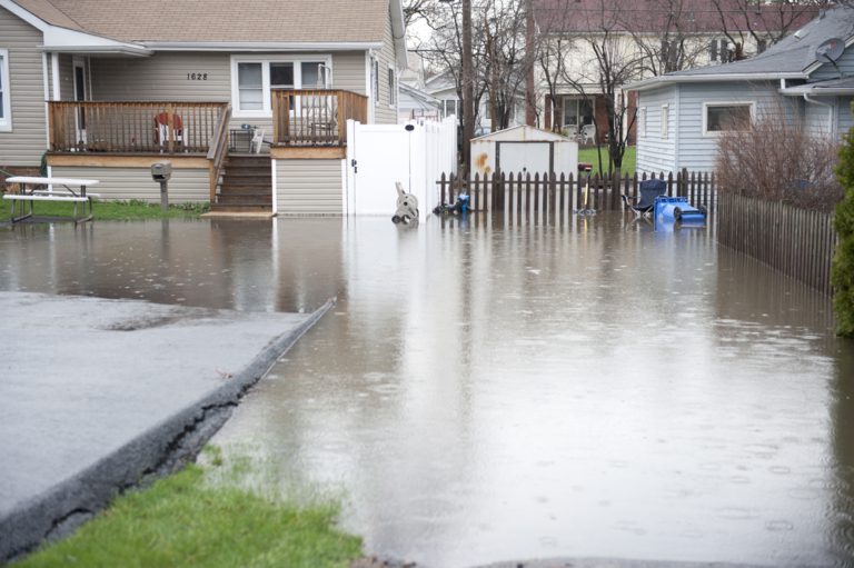 Backyard flooded in hurricane demonstrates the importance of hurricane preparation.