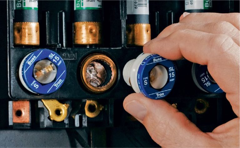 Homeowner changing a fuse illustrating how easy it is for homeowners.